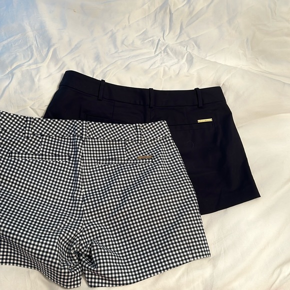 Two pairs of Michael Kors shorts size two.One solid black other navy and white - Picture 4 of 4